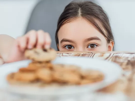 child stealing food at home